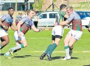  ??  ?? BRICK WALL: Despatch lock Franco Francis, left, runs into Brandwag lock Gideon Serfontein as Brandwag players Zuki Sali and Ryben Dupond look to give their teammate support