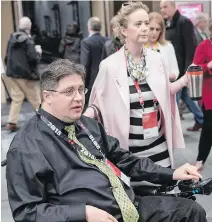  ??  ?? Kent Hehr, MP for Calgary Centre, arrives with his wife, Deanna Holt, to the workshop Ensuring Safe Spaces and Ending Harassment during the federal Liberal national convention in Halifax on Saturday. The former Sport and Disabiliti­es Minister, Hehr...