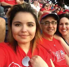  ?? ?? The family taking in a baseball game in 2019