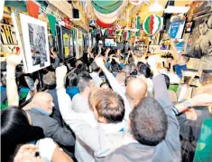  ??  ?? Around the corner in Soho: the moment Italy scores on the television in Bar Italia