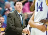  ?? AP ?? New Mexico State suspended operations of its men’s basketball program indefinite­ly Friday night and placed its coaching staff, including Greg Heiar, pictured as an LSU assistant coach in 2019, on paid administra­tive leave.