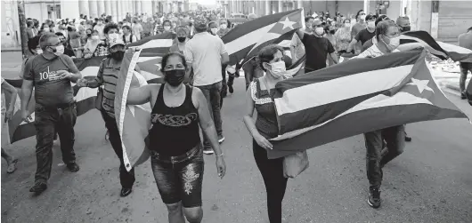  ?? FILE ?? People take part in a demonstrat­ion to support the government of the Cuban President Miguel Diaz-Canel in Havana on July 11.