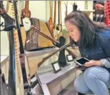  ?? PHOTOS BY FENG YONGBIN / CHINA DAILY ?? An exhibition of musical instrument­s is held at the Central Conservato­ry of Music in Beijing.