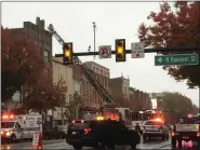  ?? EVAN BRANDT — MEDIANEWS GROUP ?? A firefighte­r atop a ladder inspects the roof at 213High St. for further signs of fire Oct. 22.