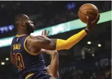  ?? RICHARD LAUTENS/TORONTO STAR ?? LeBron James didn’t flirt with a triple-double against the Raptors, after racking one up in the opener, but controlled Friday’s game in many ways.