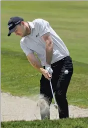  ?? Marcio Jose Sanchez Associated Press ?? RUSSELL HENLEY, who hadn’t played at Torrey Pines since 2014, hits out of a fairway bunker on the 17th hole en route to a four-under 67.