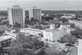  ?? PEDRO PORTAL pportal@miamiheral­d.com ?? View of the University of Miami Architectu­re School in the foreground and the Hecht and Stanford residentia­l college buildings.