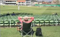  ??  ?? A spectator watches a first-clas s match at the Spitfire Ground in Canterbury. A proposed new eight-team city-based Twenty20 tournament in England moved a step closer on Tuesday in what ECB chairman called a ‘watershed moment.’