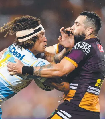  ?? Picture: AAP ?? BLITZED: Jack Bird (right) tackles Kevin Proctor of the Titans on Sunday.