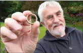 ??  ?? Mr Souter holds up one of the gold-panned rings