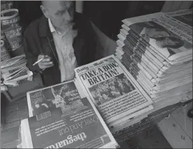  ?? Associated Press ?? n The front pages of Britain’s newspapers report on the EU referendum result just over a year ago in London.