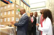  ?? ?? Health and Child Care Minister Dr Douglas Mombeshora (left) is shown cholera vaccines donated by UNICEF Health Resilience Fund, by Natpharm pharmacist Memory Mukamuri (right) in Harare yesterday. — Picture: Charles Muchakagar­a