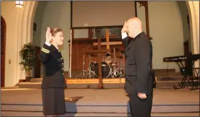  ?? Haley Smith/ News-Times ?? Oath: El Dorado Police Officer Sterling Claypoole, right, is sworn in by Lt. Brynn Turner at his commission­ing held at Immanuel Baptist Church on Sunday.