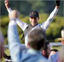  ?? PETER MORGAN — THE ASSOCIATED PRESS ?? Jose Ortiz celebrates after riding Tapwrit to victory.