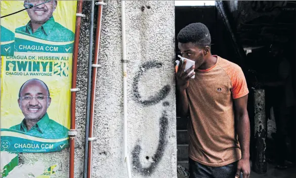  ?? Photo: Nampa/AFP ?? Doubts… A man covers his face to fight the effect of teargas while Zanzibar riot police carries out an operation after the opposition called for protests in Stone Town.