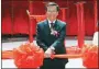  ?? JOAN LEONG - THE AP ?? In this 2010, file photo, chairman of the Malaysian Genting Group developer Tan Sri Lim Kok Thay cuts a ceremonial ribbon to open a casino in Singapore.