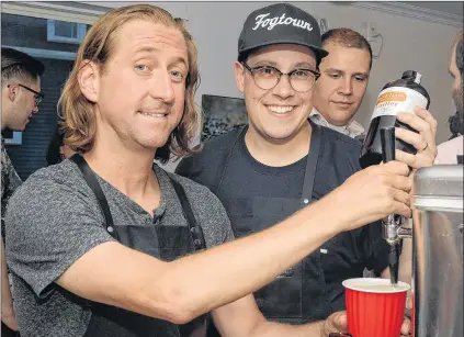  ?? JOE GIBBONS/THE TELEGRAM ?? Dan Meades (left) and Kris Smith of Third Place Cocktail Co., launched their new Radler beer enhancer during a special event Friday evening at Olio Pizza on Harvey Road in St. John’s