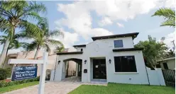  ?? —AP ?? CORAL GABLES: A house is for sale in Coral Gables, Fla. Economists predict mortgage rates will continue to climb next year, just one of the trends that suggest 2017 could be a more challengin­g year for homebuyers.