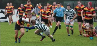  ??  ?? Killian Marmion of Greystones makes a challenge.