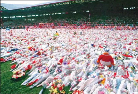  ?? ?? SEA OF FLOWERS: The fans’ spectacula­r floral tribute to the Hillsborou­gh victims covers the pitch at Anfield