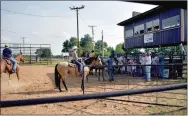  ??  ?? Competitor­s await the start of Sunday’s Play Day held at the Lincoln Riding Club Arena one mile west of Lincoln. Temperatur­es in the low 100s didn’t diminish their enthusiasm for rodeo.