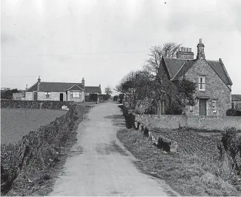 ??  ?? A view of the village as it looked in 1934. The schoolhous­e is on the right.