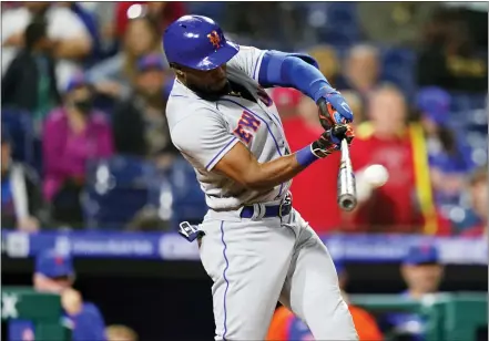  ?? MATT SLOCUM — THE ASSOCIATED PRESS ?? New York Mets’ Starling Marte hits a run-scoring double against Philadelph­ia Phillies pitcher Corey Knebel during the ninth inning of a baseball game, Thursday, May 5, 2022, in Philadelph­ia.