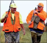  ?? (Arkansas Democrat-Gazette/Bryan Hendricks) ?? Bill Henry (left) and Bob Casali, both of Little Rock, return to the truck after combing a milo field for pheasants Friday in South Dakota.