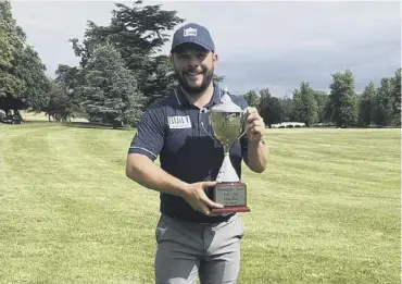  ??  ?? 0 Conor O’neil shows off the trophy after his Jessie May World Snooker Golf Championsh­ip win