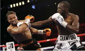  ?? Photograph: Chase Stevens/AP ?? Terence Crawford hits Shawn Porter during their WBO welterweig­ht title match on Saturday night in Las Vegas.