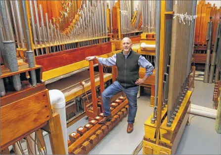  ?? MIKE DE SISTI / MDESISTI@JOURNALSEN­TINEL.COM ?? Paul Woelbing stands in a room that houses some of the thousands of pipes used to play the theater pipe organ he’s having built in a Carma Laboratori­es Inc. warehouse. To see more photos and a video, go to jsonline.com/multimedia.