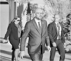  ??  ?? Michel (centre) arrives to attend the United Nations conference on migration in the Moroccan city of Marrakesh. — AFP photo