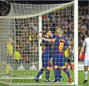  ?? Photo: Zimbio ?? Lionel Messi and Luis Suarez celebrate a Barcelona goal against Roma on April 5, 2018.