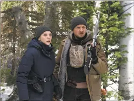  ?? FRED HAYES — THE WEINSTEIN COMPANY ?? Elizabeth Olsen and Graham Greene seek a murder suspect in “Wind River.”