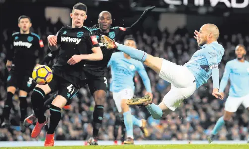  ??  ?? Karate kid: David Silva scores his 83rd-minute winner against West Ham in dramatic style at the Etihad