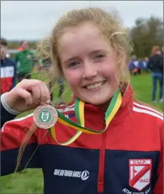  ??  ?? Eabha Keane with her Under-10 bronze medal.