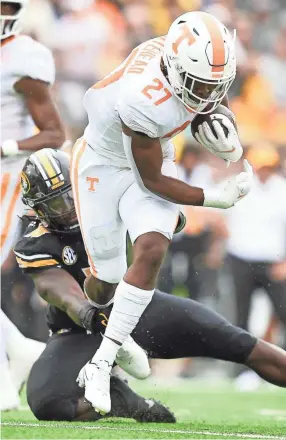  ?? CALVIN MATTHEIS/NEWS SENTINEL ?? Tennessee running back Len'neth Whitehead runs the ball during an Oct. 2 game against Missouri at Faurot Field in Columbia, Mo..