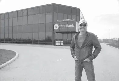  ?? DEREK RUTTAN / POSTMEDIA NEWS ?? VersaBank president Dave Taylor in front of the new VersaBank Innovation Centre of Excellence in London, Ont.