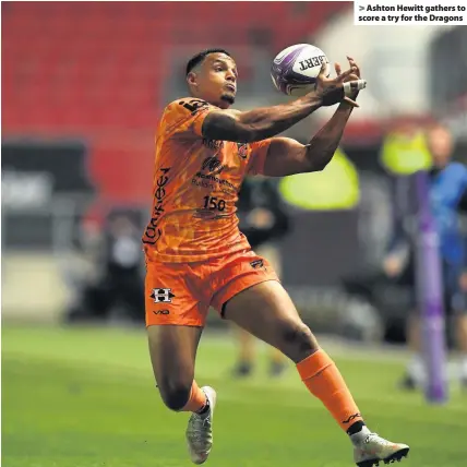  ??  ?? Ashton Hewitt gathers to score a try for the Dragons