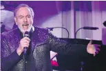  ?? CHRIS PIZZELLO/THE ASSOCIATED PRESS ?? “I love the chemistry with the audience and myself,” Neil Diamond says of his Hot August Night III DVD.