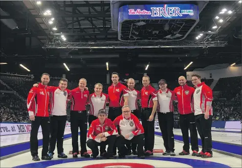  ??  ?? It was a night for the Tim Hortons Brier record book Wednesday when two teams from Newfoundla­nd and Labrador played against each other. The teams gathered for a photo after the game, won by Team Canada’s Brad Gushue over Greg Smith. Both teams hail...