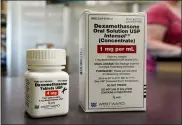  ?? NATI HARNIK — THE ASSOCIATED PRESS ?? Packages of Dexamethas­one are displayed in a pharmacy June 16 in Omaha, Neb. Researcher­s in England said they have the first evidence that the drug can improve COVID-19 survival. The cheap, widely available steroid called dexamethas­one reduced deaths by up to one third in severely ill hospitaliz­ed patients.