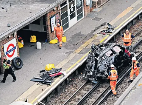  ?? ?? The scene of the crash on the Tube line in Park Royal, west London; left, Maya Kodsi, 37, sister of Yagmur Ozden, and Yagmur’s daughter Melek Ozden, 13