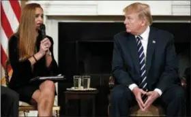  ?? ASSOCIATED PRESS ?? President Donald Trump, looks to Julia Cordover, the student body president at Marjory Stoneman Douglas High School in Parkland, Fla., as she speaks during the listening session with high school students, teachers, and others in the State Dining Room...