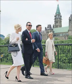  ?? CP PHOTO/ADRIAN WYLD ?? Minister of Finance William Morneau and his wife Nancy McCain walk with U.S. Treasury Secretary Steven Mnuchin and Ms. Louise Linton through a park Friday in Ottawa.