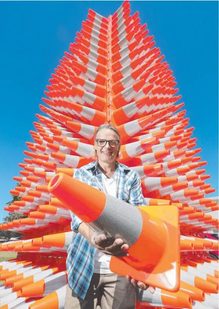  ?? Picture: RICHARD GOSLING ?? Gold Coast artist Clayton Blake has used 1000 traffic cones in his meaningful offering at Swell Festival.