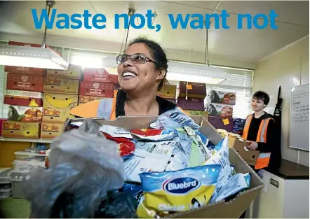  ?? ROBERT KITCHIN/STUFF ?? Kiwi Community Assistance operations manager Tracy Wellington with volunteer Andrew Jackson among some of the rescued food being redistribu­ted to charities in Wellington.