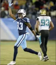  ?? MARK ZALESKI — THE ASSOCIATED PRESS ?? Tennessee Titans cornerback Tye Smith (33) celebrates after a play against the Jacksonvil­le Jaguars in the second half of an NFL football game Sunday in Nashville, Tenn. The Titans won 15-10.