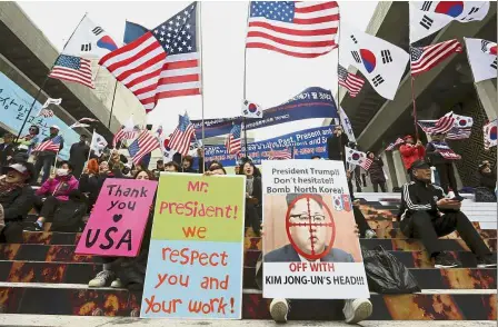 ??  ?? Strong objection: Protesters staging a rally opposing the planned summit between Moon and Kim near the US Embassy in Seoul. — AP