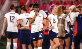  ?? Photograph: Robert Gauthier/Los Angeles Times/Shuttersto­ck ?? Carli Lloyd stands alone as she and her USA teammates reflect on the Olympic semi-final defeat by Canada.